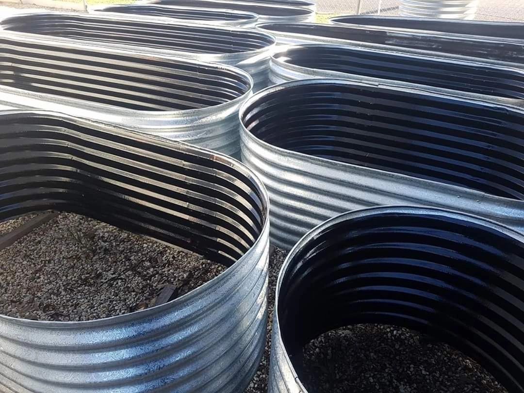 Corrugated metal rainwater tanks and garden beds